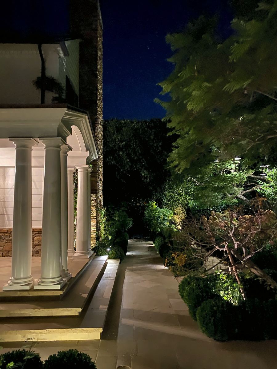Lit colonnade entry dusk