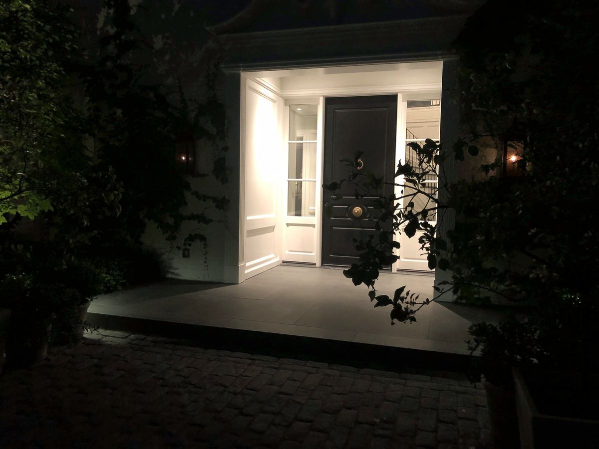 Lit front entry door night