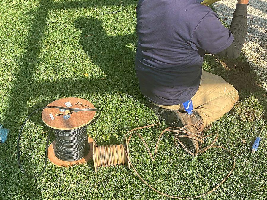 Cable being re-buried and turf reset