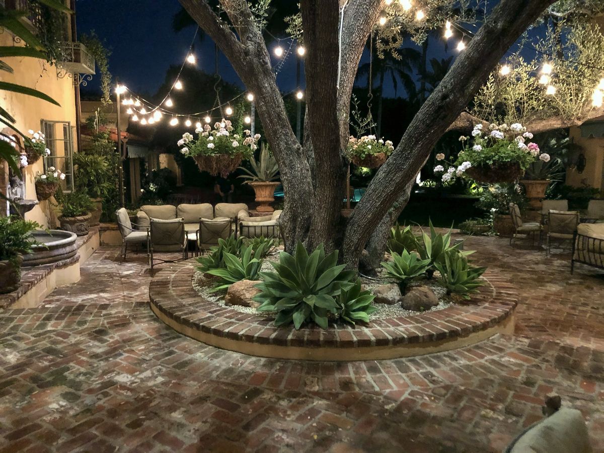 String lit brick courtyard agaves