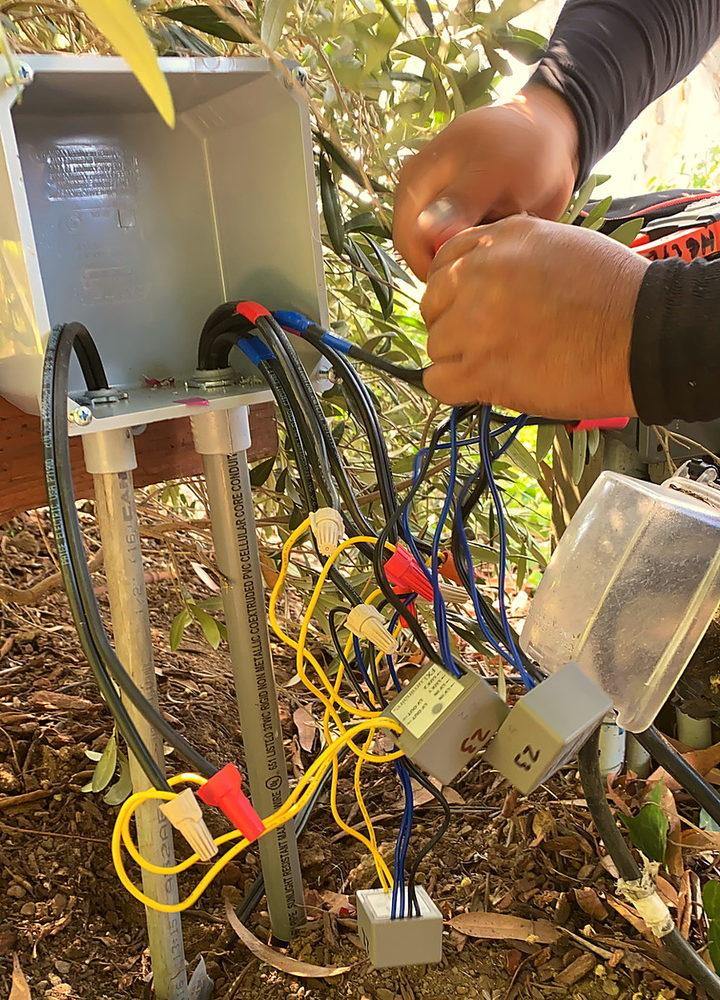 A technician testing a control box on site