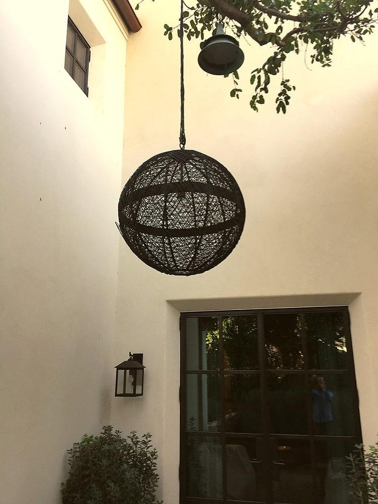 A custom woven globe fixture