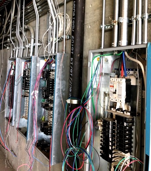 LightScaper installer wiring an electrical panel